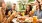 a group of people outside sitting around a table with food and drinks Taryn at 401 luxury apartments for rent Garner NC 