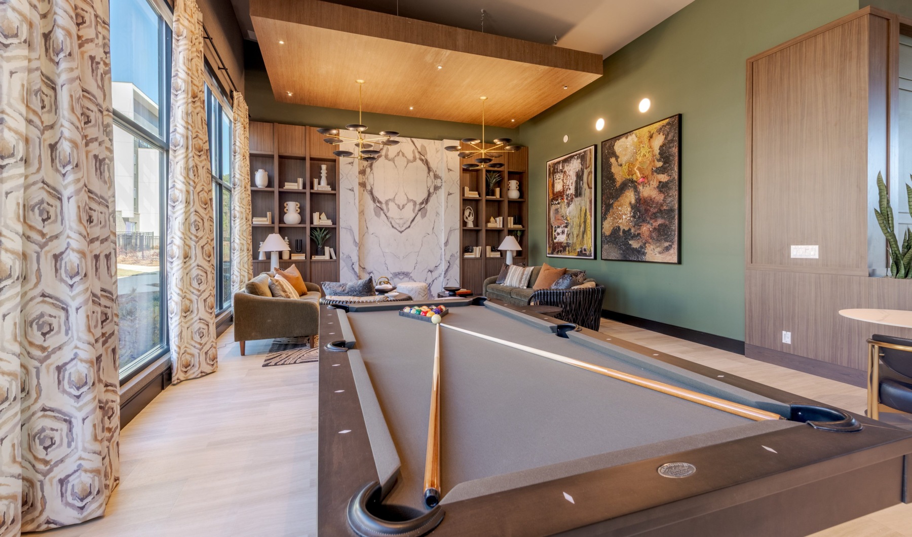 pool table by chairs and table Taryn at 401 Raleigh NC luxury apartments 