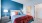 bedroom bed and nightstands by bathroom and closet  Taryn at 401 Raleigh NC luxury apartments 