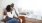 2 people sitting on a couch Taryn at 401 apts Raleigh NC 