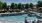 a person standing in a swimming pool Taryn at 401 luxury apartments Raleigh NC 