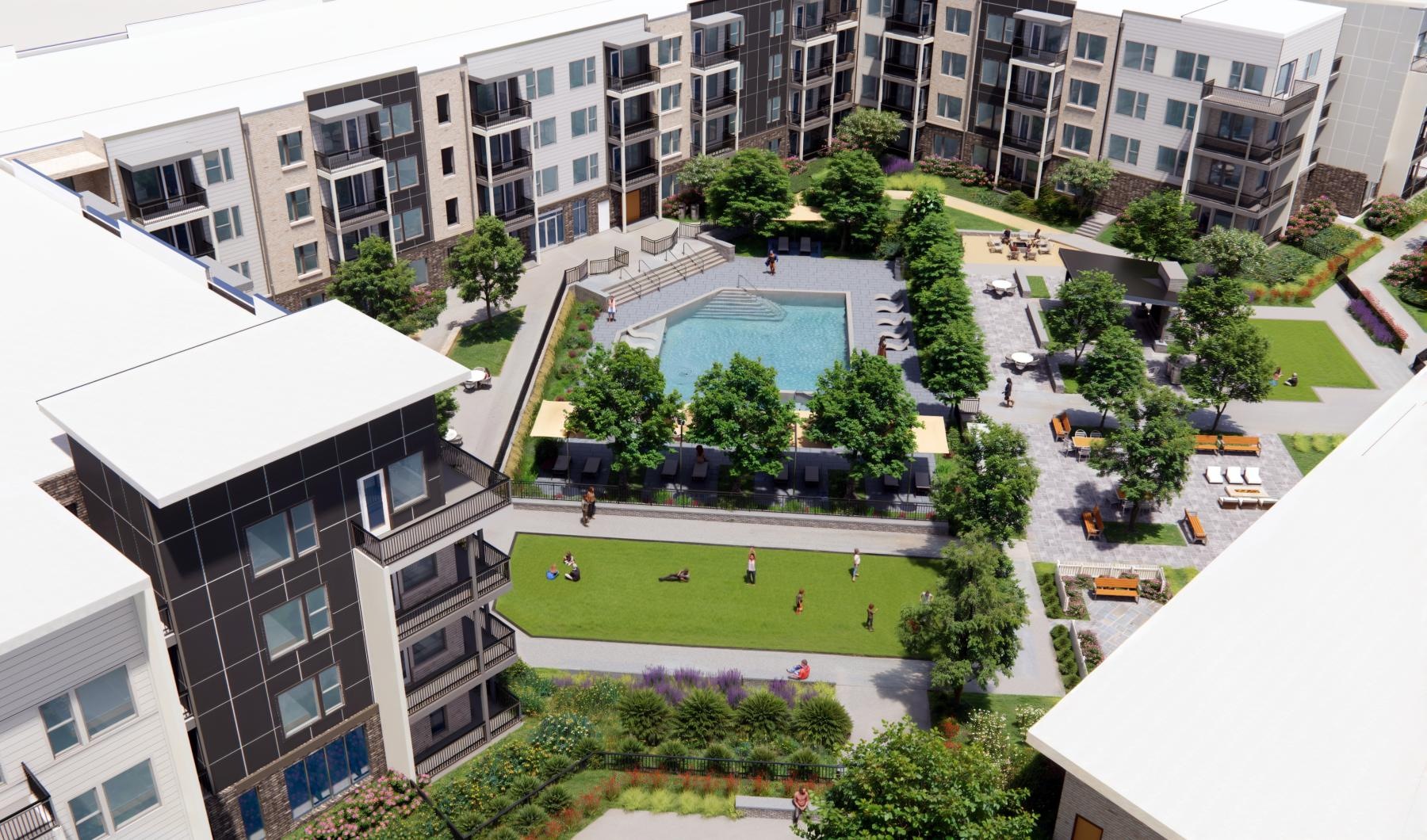 a courtyard between buildings with a pool Taryn at 401 luxury apartments for rent Raleigh NC