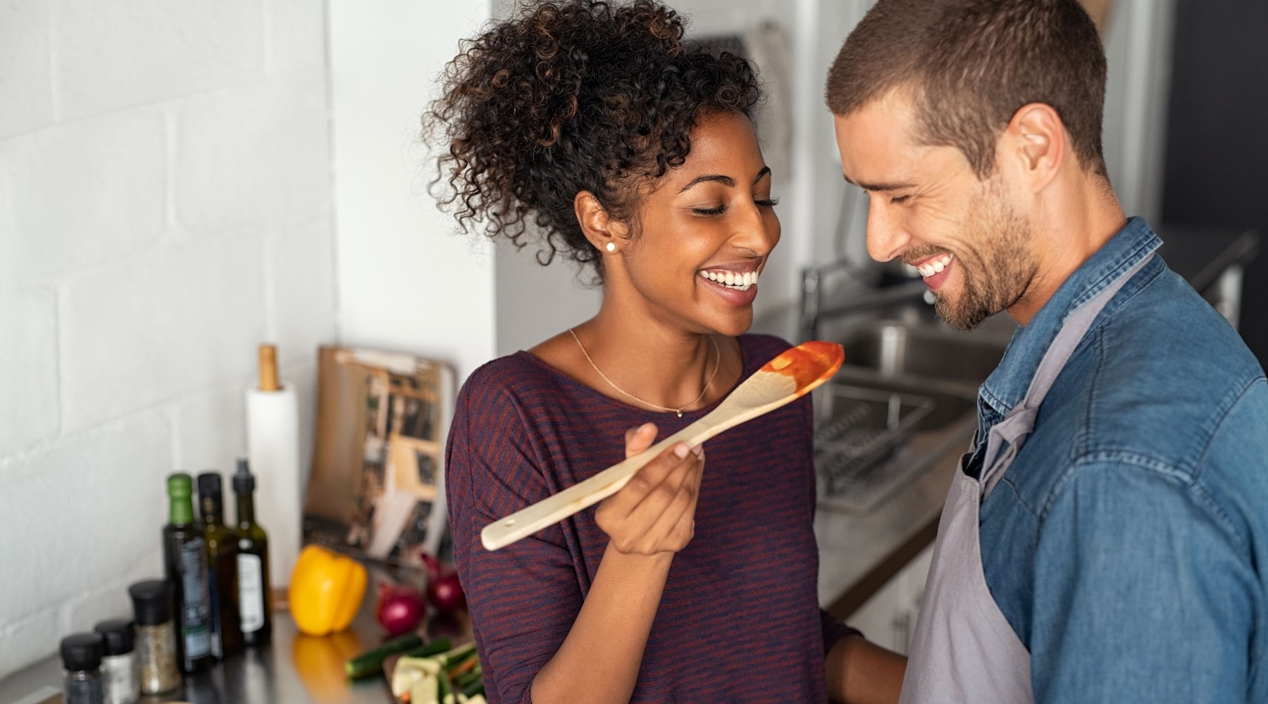 a couple cooking dinner together Taryn at 401 luxury apartments for rent Raleigh NC