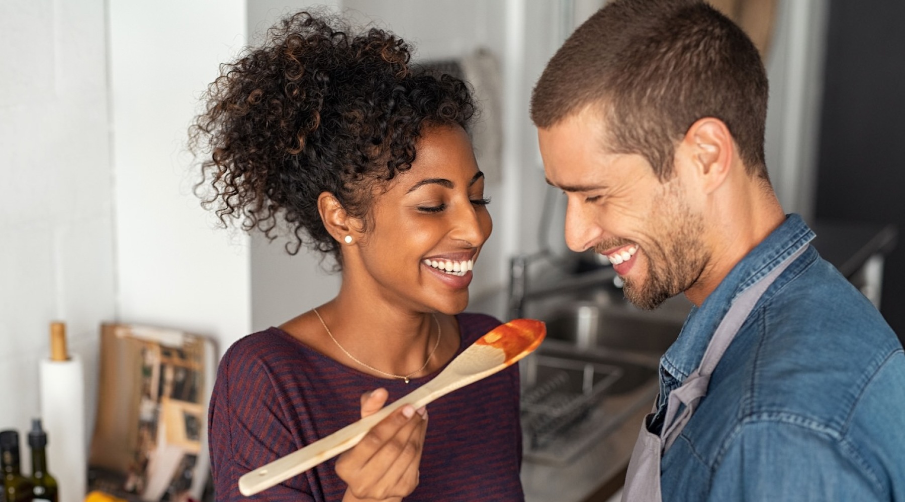 a couple cooking dinner together Taryn at 401 luxury apartments for rent Raleigh NC